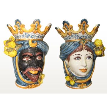 Pair of Sicilian Moorish heads with lemons. They feature a man and a woman decorated in rich shades of blue and orange. Handcrafted in Caltagirone, Italy.