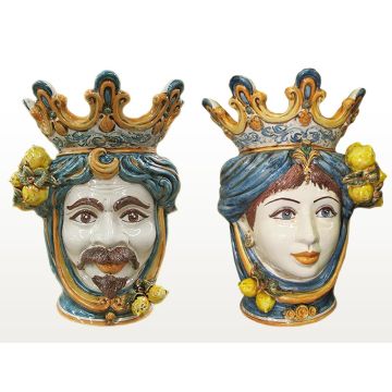 Pair of Sicilian Moorish heads with lemons. They feature a female and a male character decorated in rich shades of blue and orange. Handcrafted in Caltagirone, Italy.