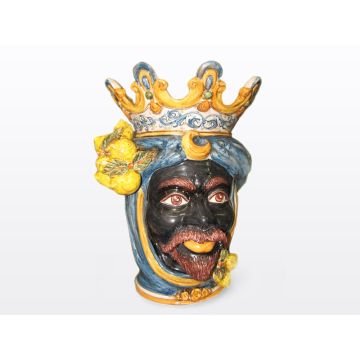 Sicilian head with lemons. It features a Moorish character decorated in rich shades of blue and orange. It is handcrafted in Caltagirone, Italy. Large