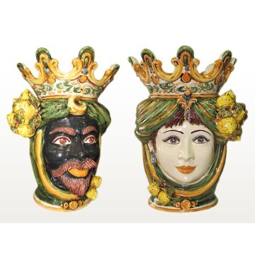 Pair of Sicilian Moorish heads with lemons. They feature a man and a woman decorated in rich shades of green and orange. Handcrafted in Caltagirone, Italy.