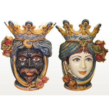 Pair of Sicilian Moorish heads with pomegranates. They feature a man and a woman decorated in rich shades of blue and orange. Handcrafted in Caltagirone, Italy.