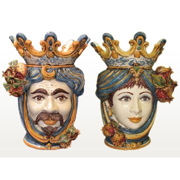 Pair of Sicilian Moorish heads with pomegranates. They feature a female and a male character decorated in rich shades of blue and orange. Handcrafted in Caltagirone, Italy.