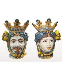 Pair of Sicilian Moorish heads with lemons. They feature a female and a male character decorated in rich shades of blue and orange. Handcrafted in Caltagirone, Italy.