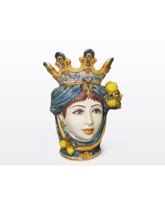Sicilian Moorish head with lemons. It features a female character decorated in rich shades of blue and orange. It is handcrafted in Caltagirone, Italy. Large