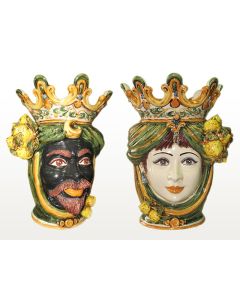 Pair of Sicilian Moorish heads with lemons. They feature a man and a woman decorated in rich shades of green and orange. Handcrafted in Caltagirone, Italy.