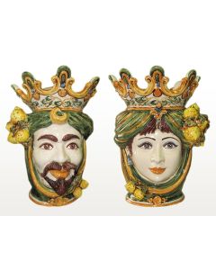 Pair of Sicilian Moorish heads with lemons. They feature a female and a male character decorated in rich shades of green and orange. Handcrafted in Caltagirone, Italy.