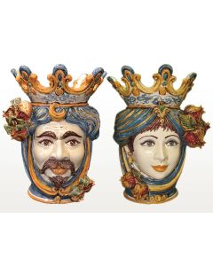 Pair of Sicilian Moorish heads with pomegranates. They feature a female and a male character decorated in rich shades of blue and orange. Handcrafted in Caltagirone, Italy.
