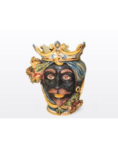 Sicilian head with pomegranates. It features a Moorish character decorated in rich shades of blue and orange. It is handcrafted in Caltagirone, Italy. Small