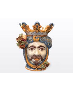 Sicilian Moorish head with pomegranates. It features a male character decorated in rich shades of blue and orange. It is handcrafted in Caltagirone, Italy. Large