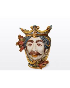 Sicilian Moorish head with pomegranates. It features a male character decorated in rich shades of blue and orange. It is handcrafted in Caltagirone, Italy. Small