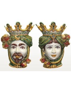 Pair of Sicilian Moorish heads with pomegranates. They feature a female and a male character decorated in rich shades of green and orange. Handcrafted in Caltagirone, Italy.